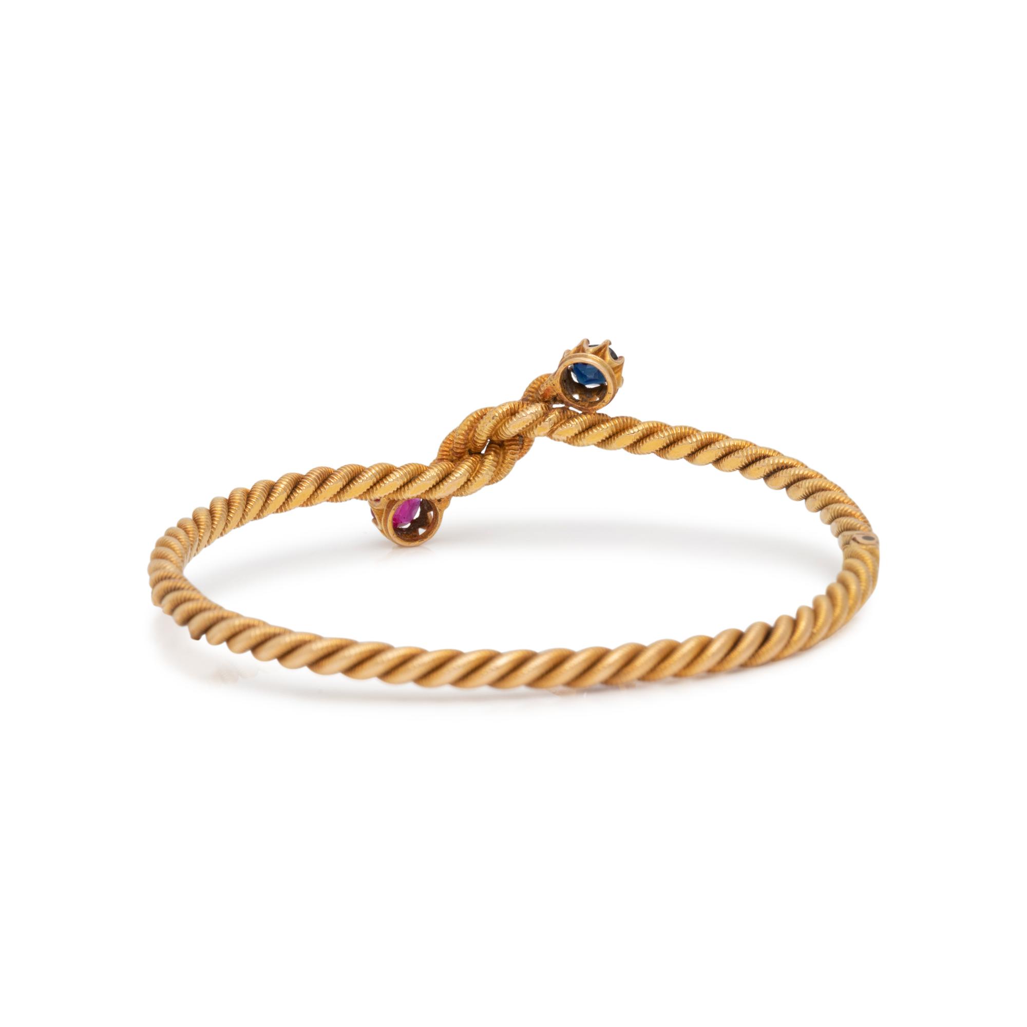 YELLOW GOLD, RUBY AND SAPPHIRE BANGLE BRACELET