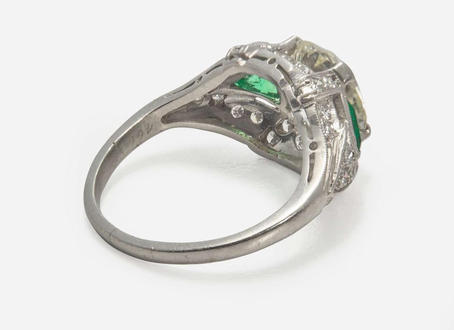 A Platinum, Diamond, and Emerald Art Deco Ring