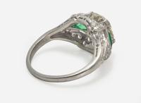 A Platinum, Diamond, and Emerald Art Deco Ring