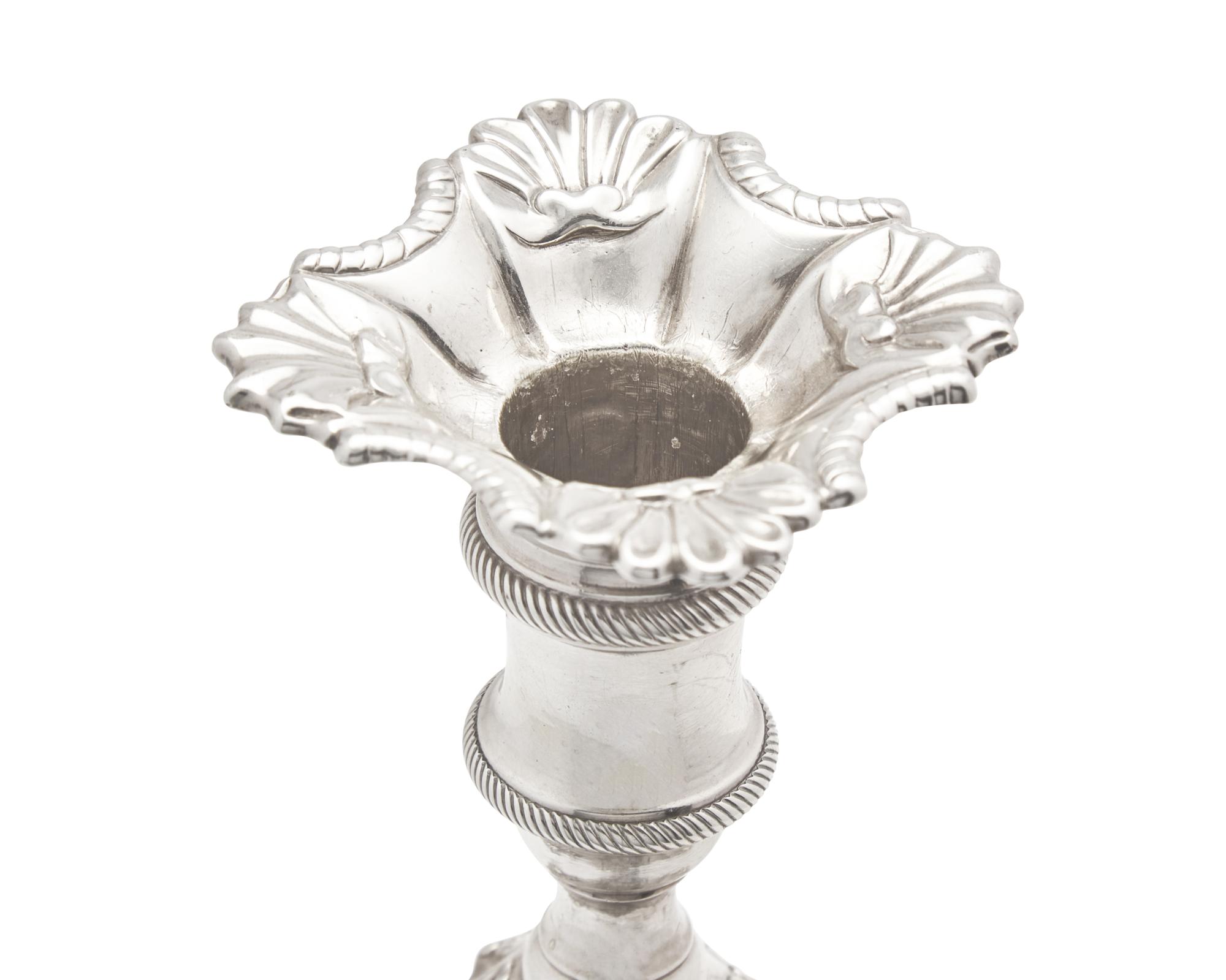 An Assembled Set Of Four George III Sterling Silver Candlesticks