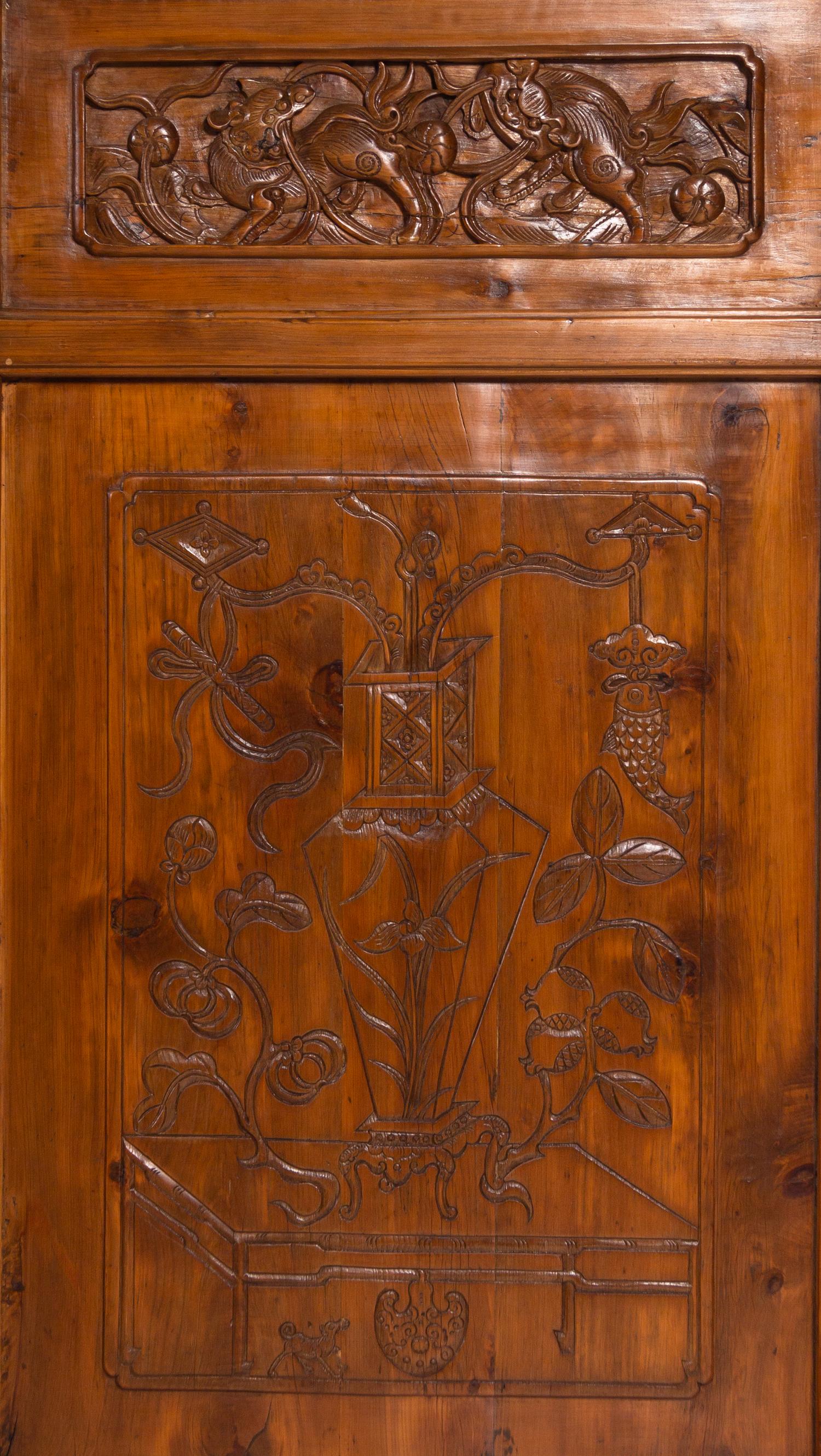 A Set of Four Chinese Softwood Door Panels