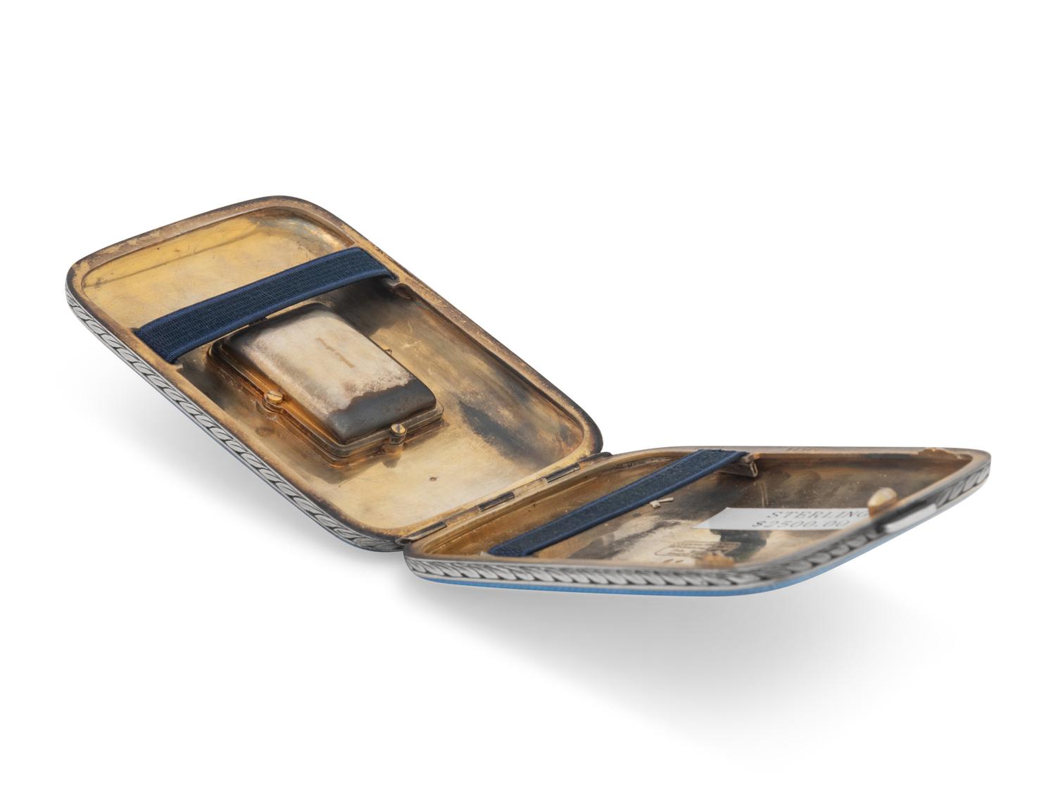 A Swiss Guilloche Enameled Silver and Clock-Inset Cigarette Case
