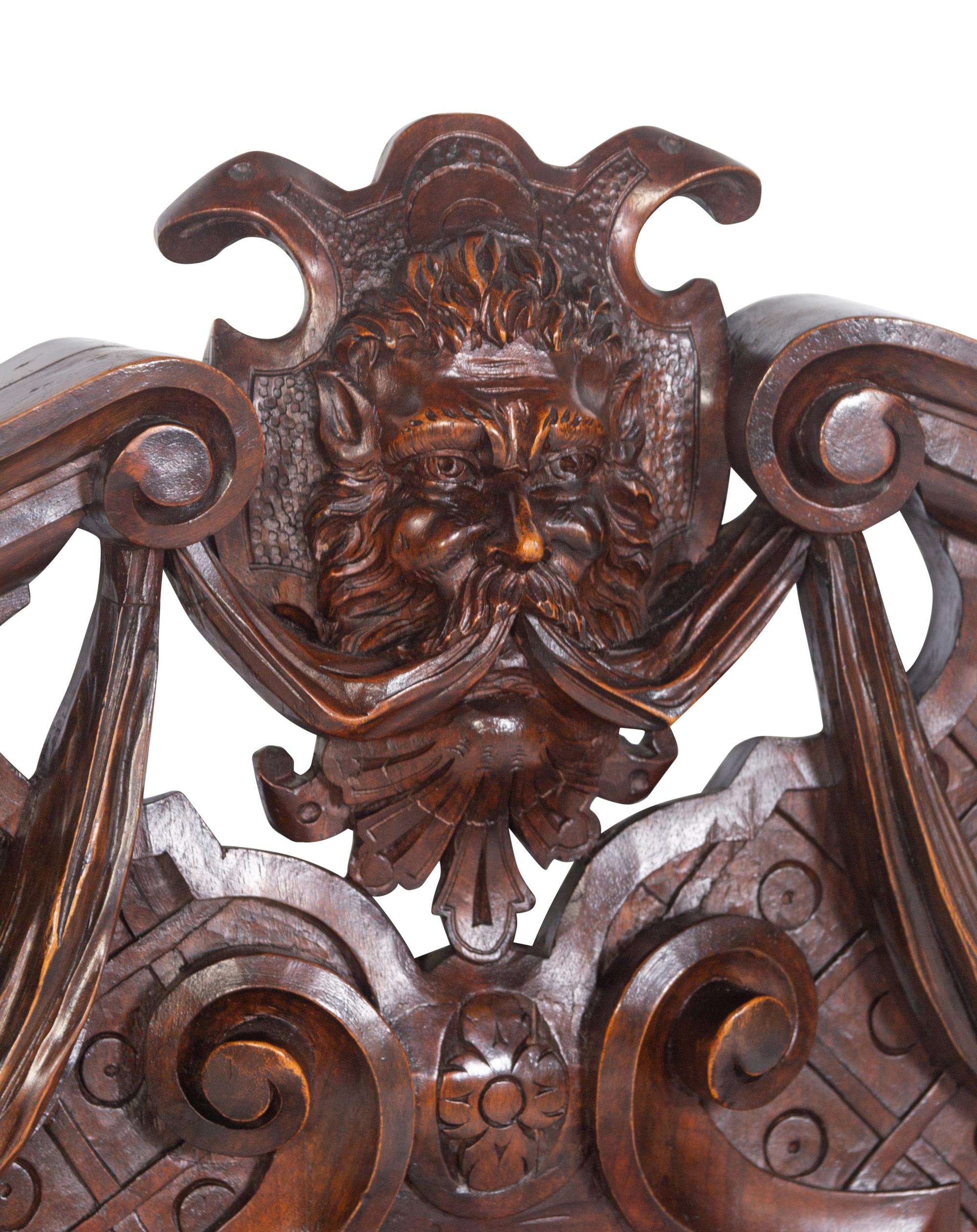 A Pair of Italian Baroque Style Carved Walnut Benches