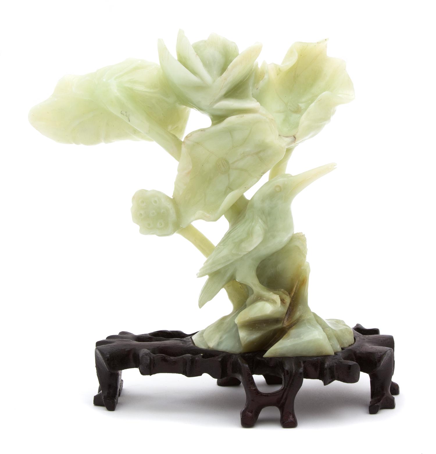 A Chinese Carved Green Hardstone Bird and Lotus Blossom Height 7 inches. — 20TH CENTURY