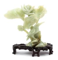 A Chinese Carved Green Hardstone Bird and Lotus Blossom Height 7 inches. — 20TH CENTURY