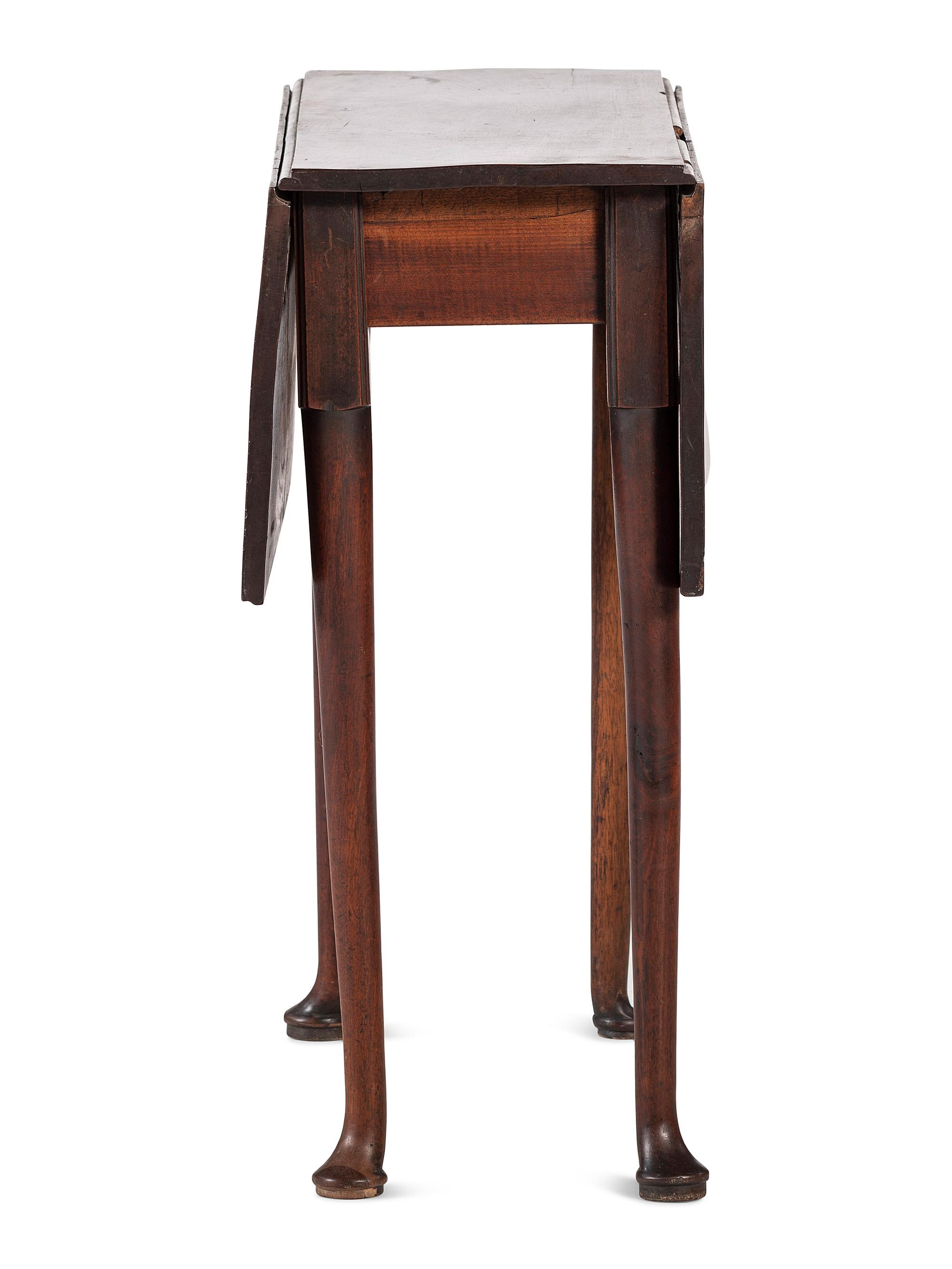 A George III Figured Mahogany Pad-Foot Drop-Leaf Table