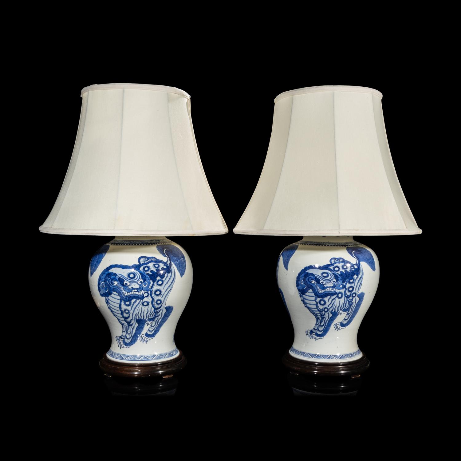 A Pair of Chinese Blue and White 'Buddhist Lion' Porcelain Jars, Kangxi Period or Later 清康熙或更晚 青花佛獅紋罐一對