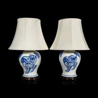A Pair of Chinese Blue and White 'Buddhist Lion' Porcelain Jars, Kangxi Period or Later 清康熙或更晚 青花佛獅紋罐一對