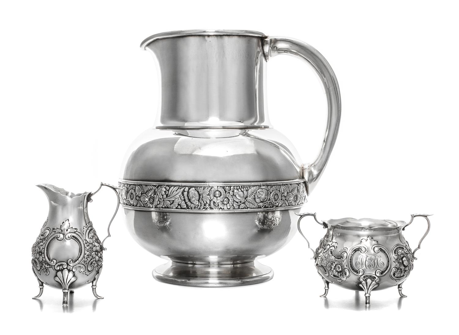 An American Silver-Plate Pitcher, Gorham Mfg. Co., Providence, RI, 1883, having a flattened spherical body with a cylindrical neck, the
