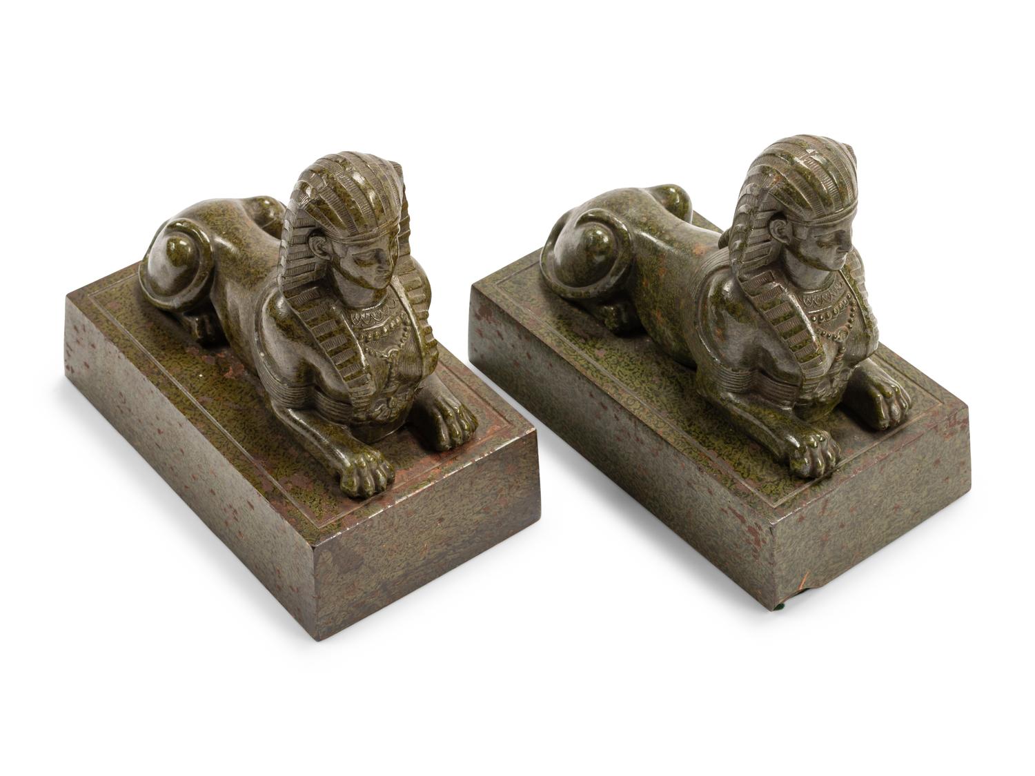 A Pair of Continental Patinated Metal Sphinxes