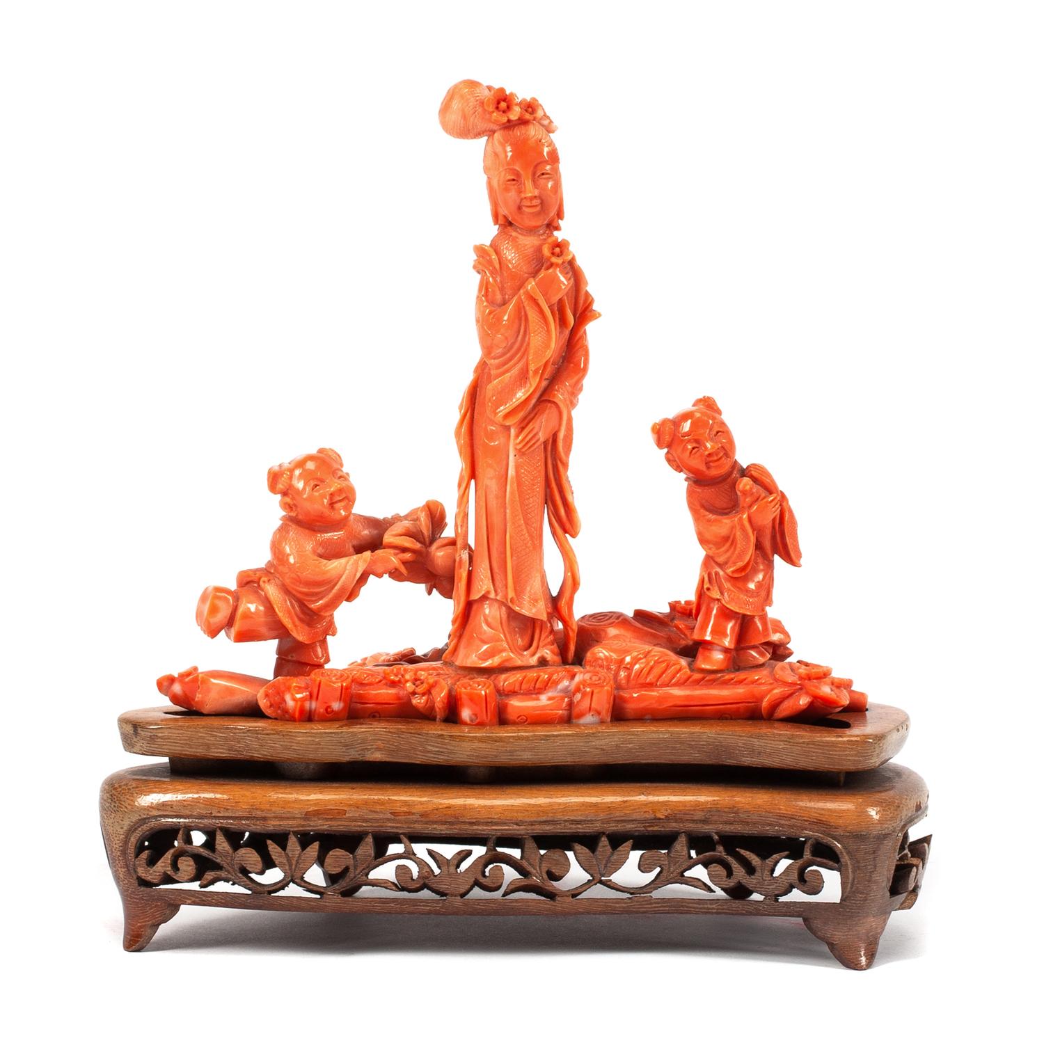 A Chinese Carved Coral Figural Group Width 6 1/4 inches.
