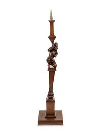 A Black Forest Carved Pricket