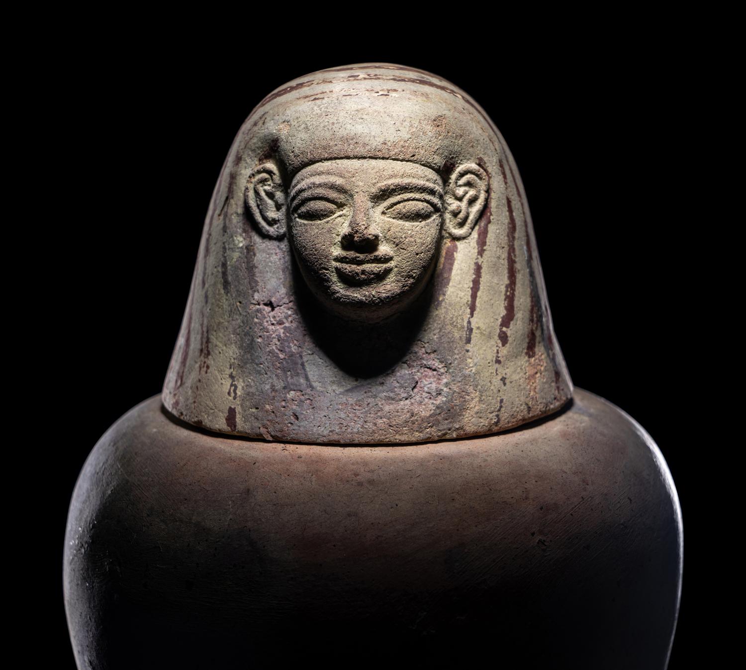 An Egyptian Painted Pottery Canopic Jar