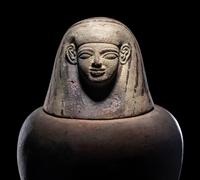An Egyptian Painted Pottery Canopic Jar