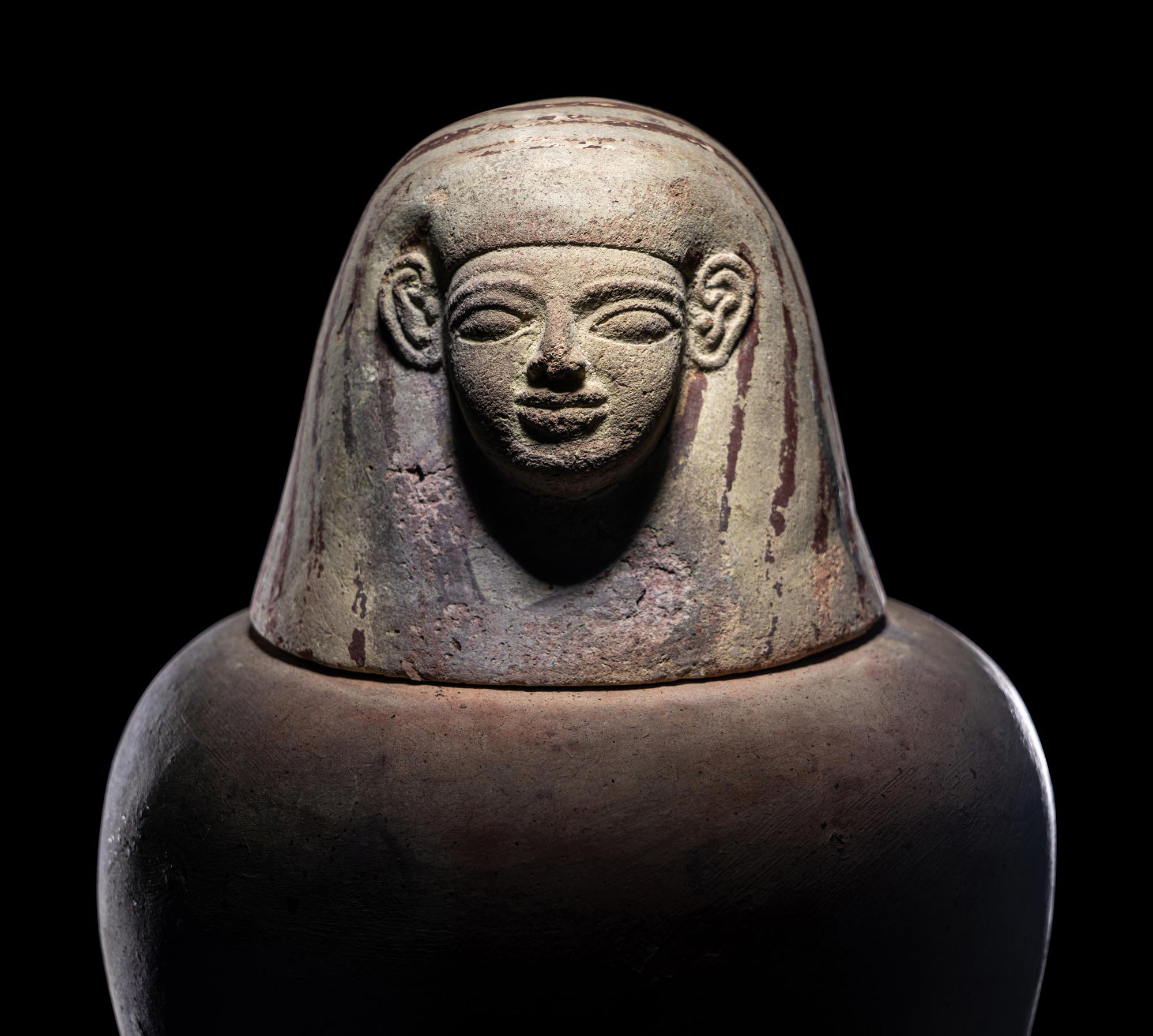 An Egyptian Painted Pottery Canopic Jar