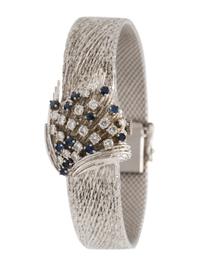 MOVADO, 18K WHITE GOLD, DIAMOND AND SAPPHIRE SURPRISE WRISTWATCH