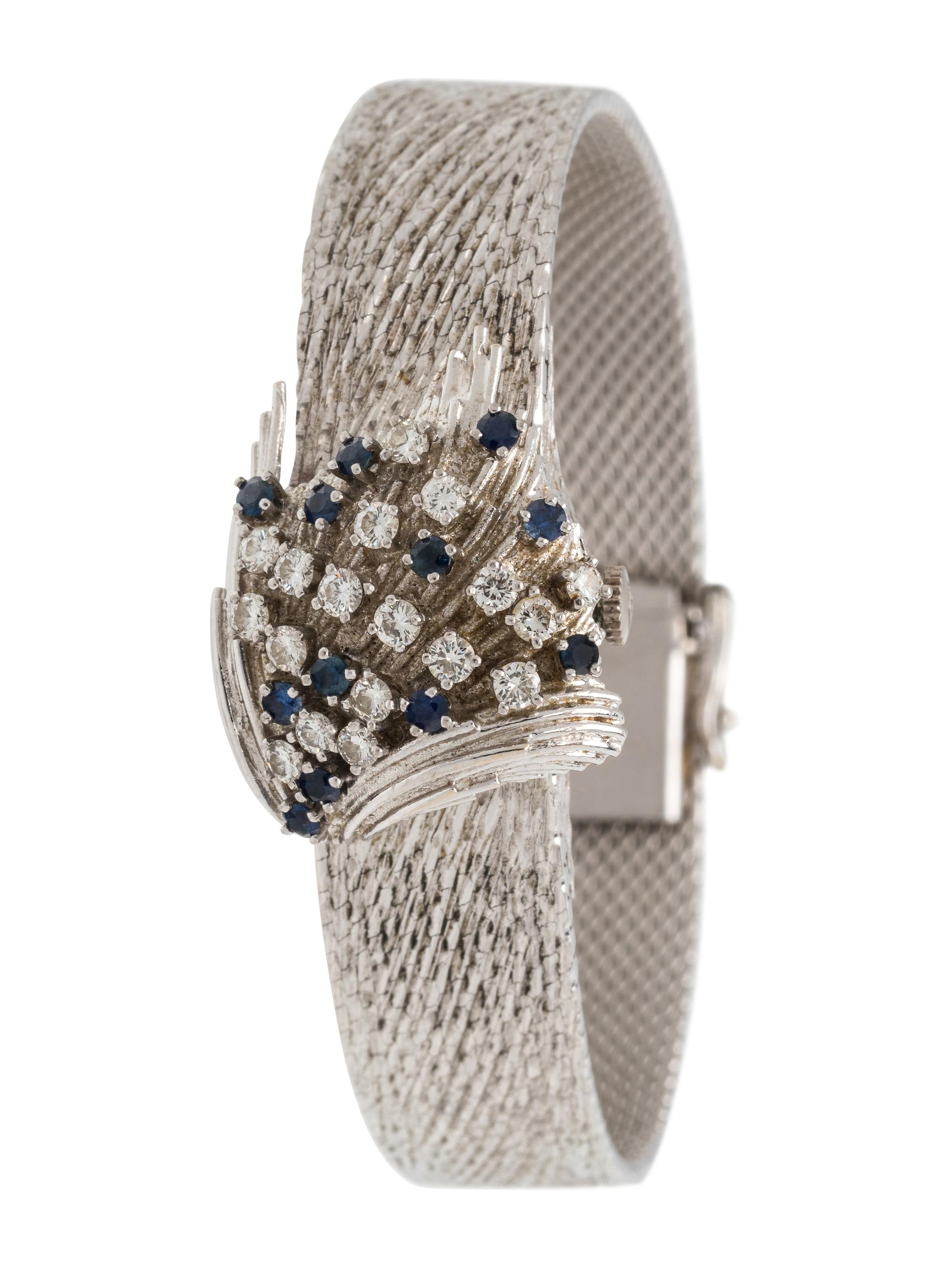 MOVADO, 18K WHITE GOLD, DIAMOND AND SAPPHIRE SURPRISE WRISTWATCH
