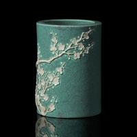 A Chinese "Robin's-Egg" Glazed Porcelain Brushpot, Qing Dynasty, Probably 19th Century — 清晚期 爐鈞釉貼塑梅花圖筆筒