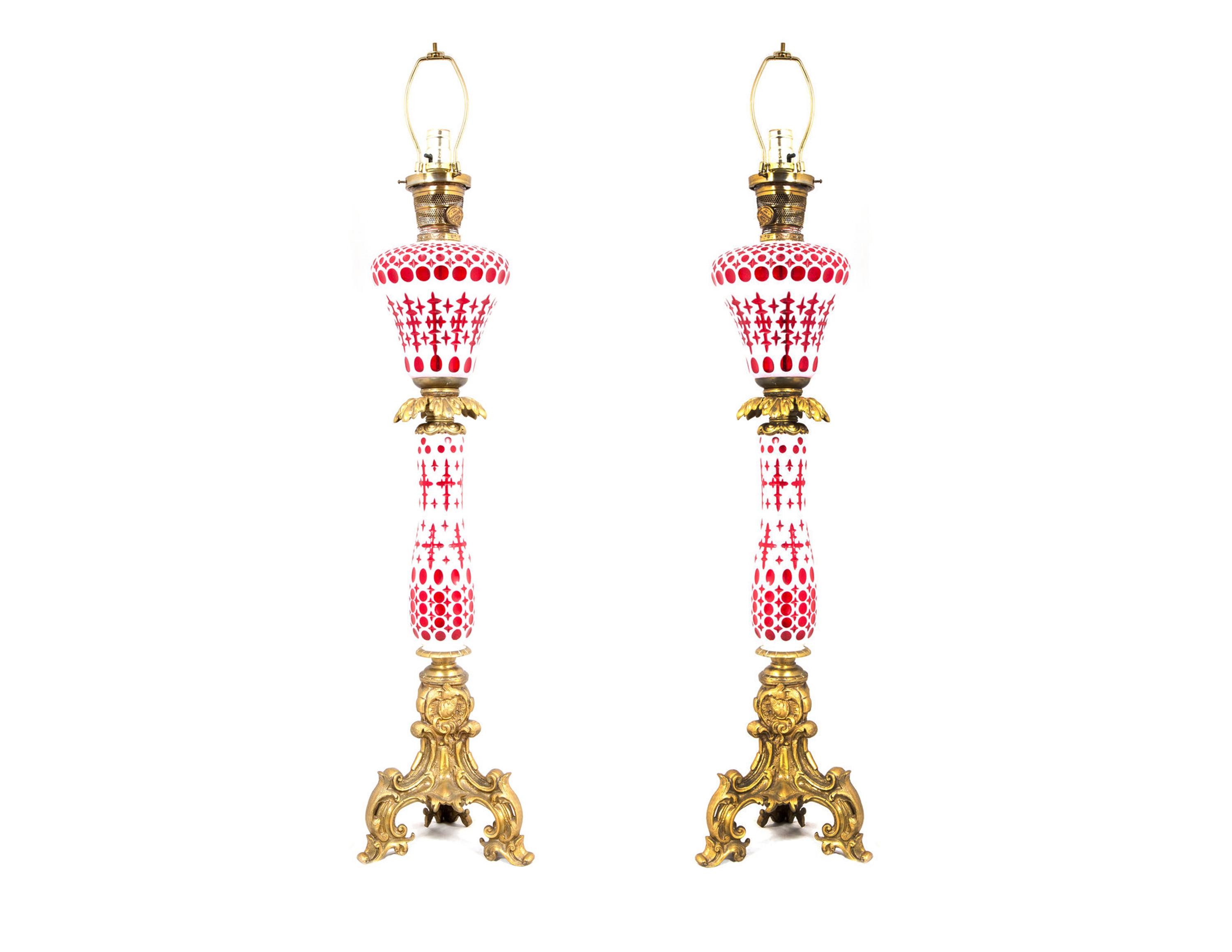 A Pair of White Opaque Cut-to-Cranberry Glass Fluid Lamps by Boston and Sandwich Glass Co., MA