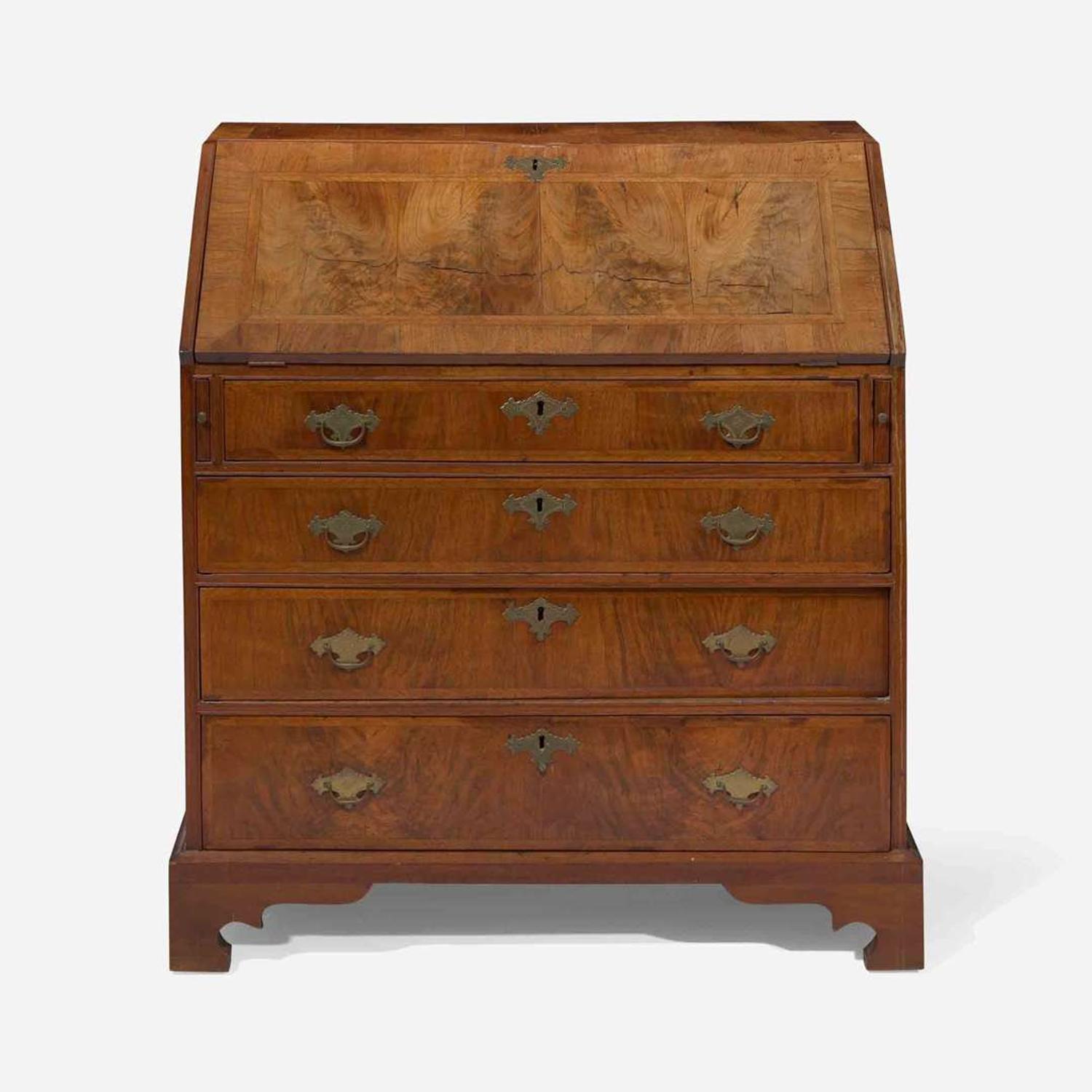 A Queen Anne walnut-banded and pine slant-front desk circa 1740