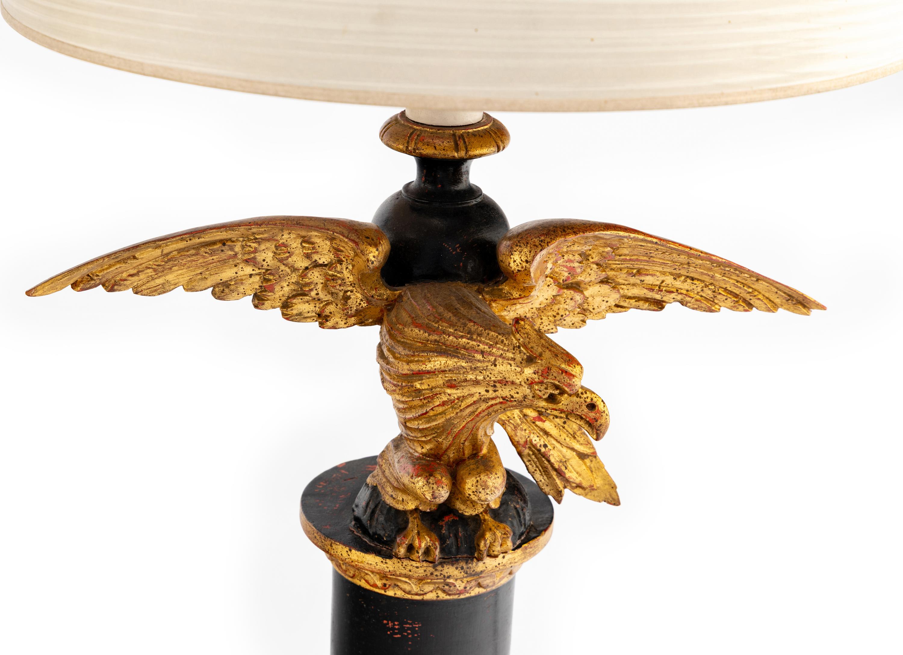 A Pair of Painted and Parcel Gilt Eagle-Form Lamps