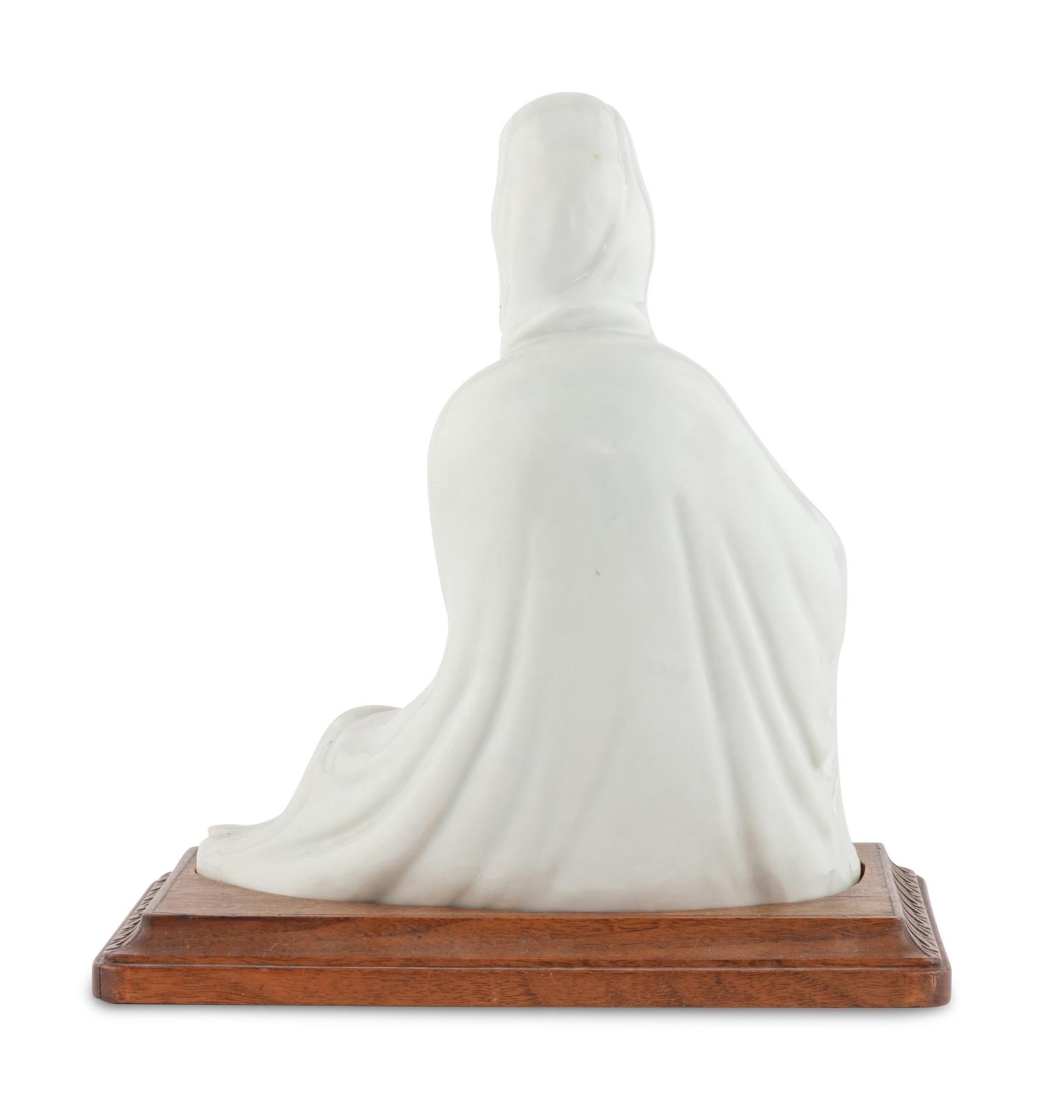 A Chinese Iron Red Decorated Porcelain Figure of Guanyin