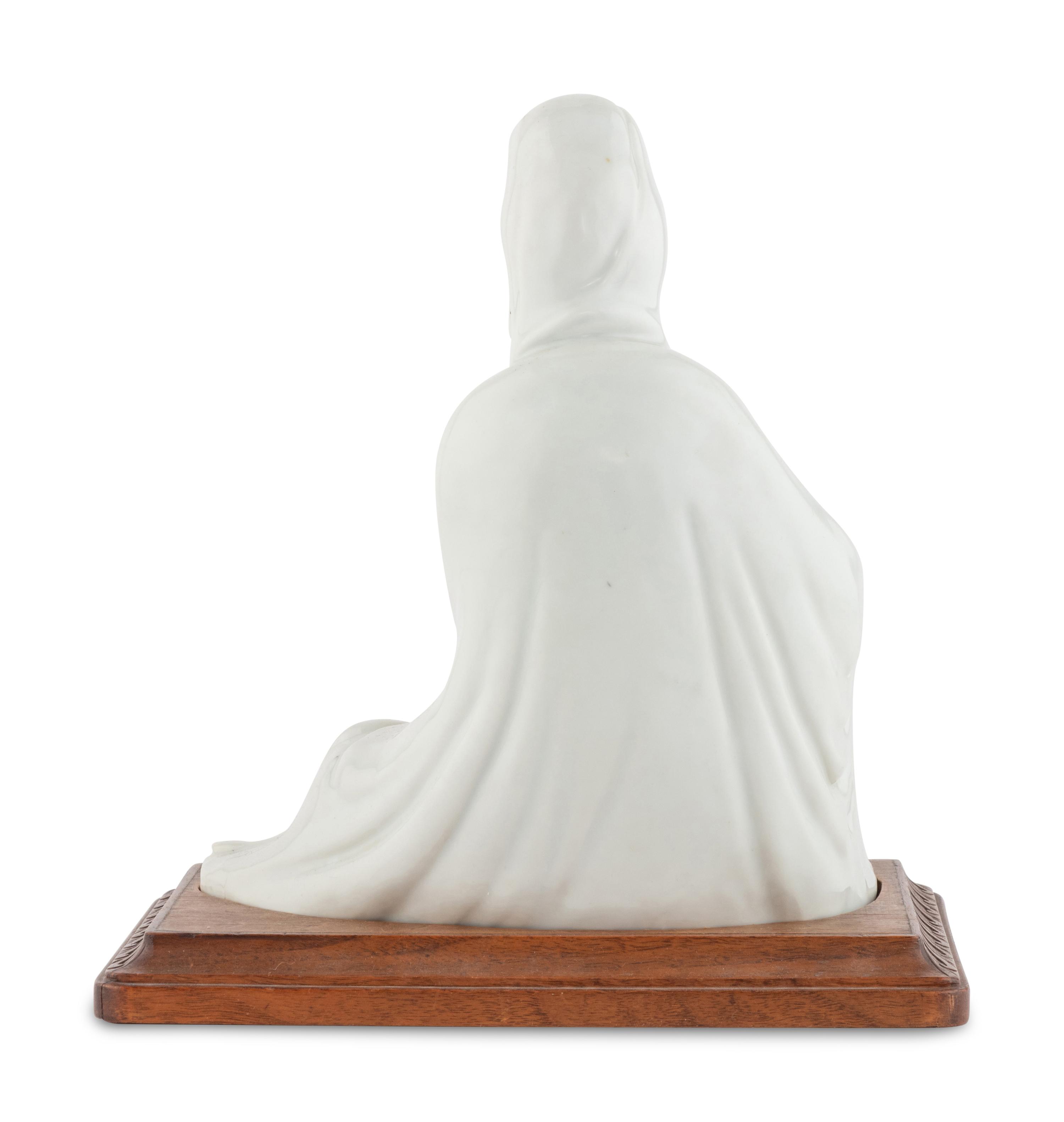 A Chinese Iron Red Decorated Porcelain Figure of Guanyin
