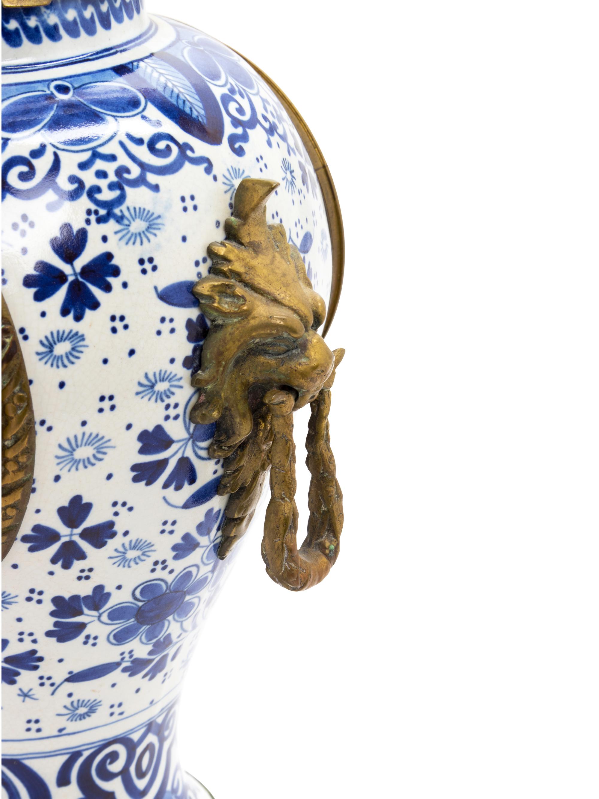 A Delft Pottery Three-Piece Clock Garniture