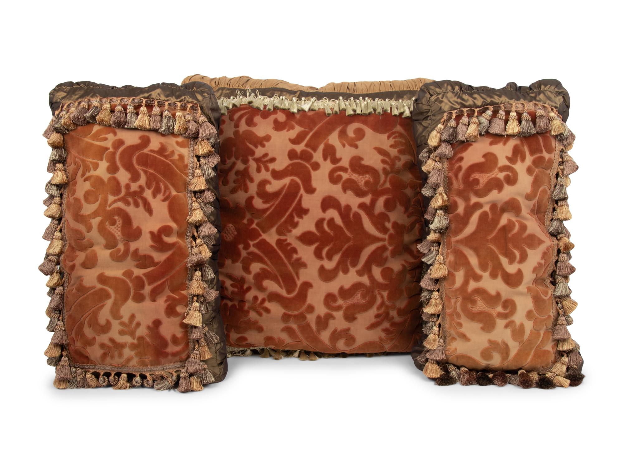 A Set of Three Velvet Upholstered Pillows with Tassels