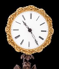 A French Gilt and Patinated Bronze Mystery Clock, with Wood Base, Attributed to Jean Eugene Robert Houdin