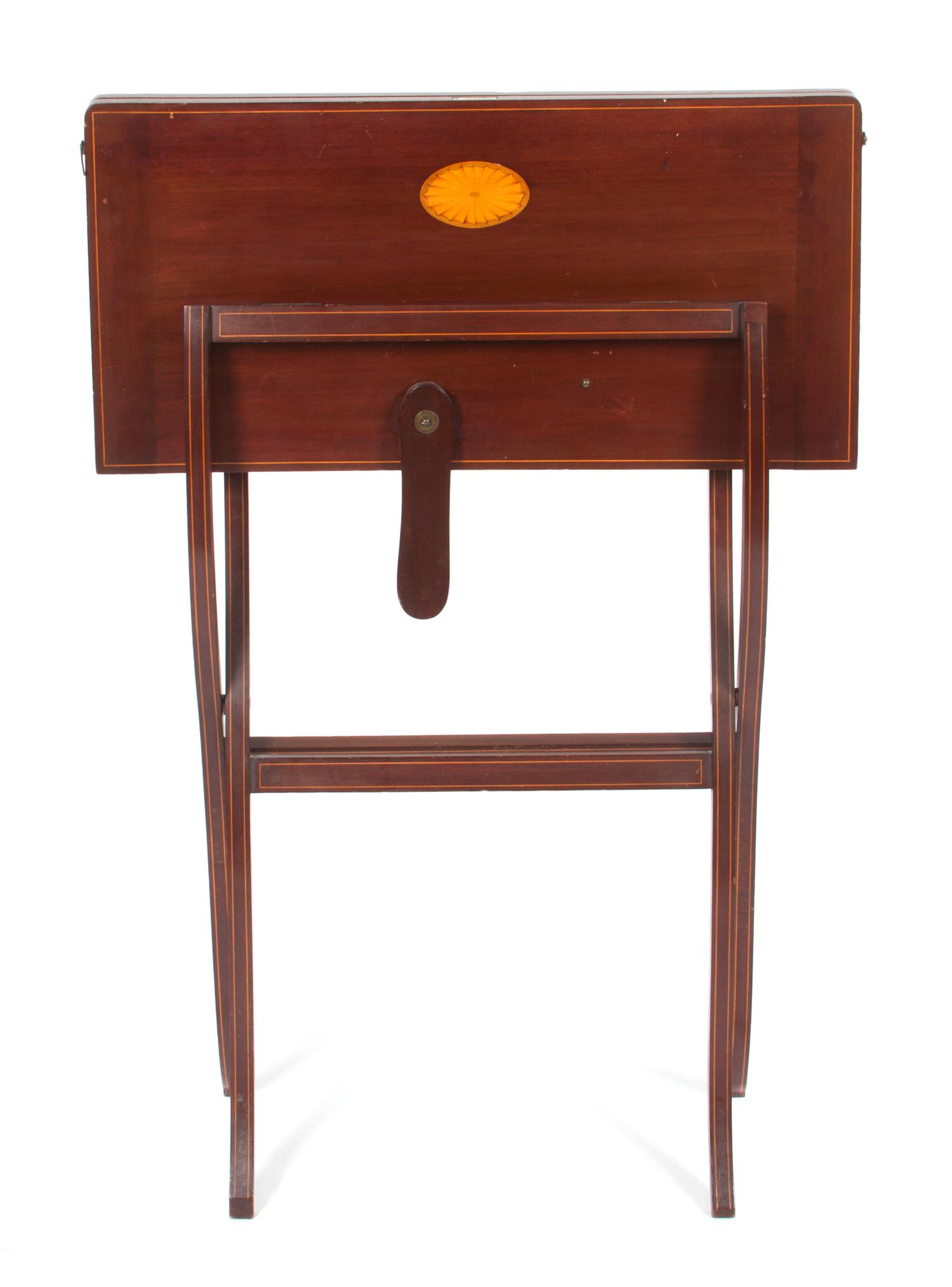 A Georgian Style Mahogany Coaching Table Height 38 1/2 inches (closed).