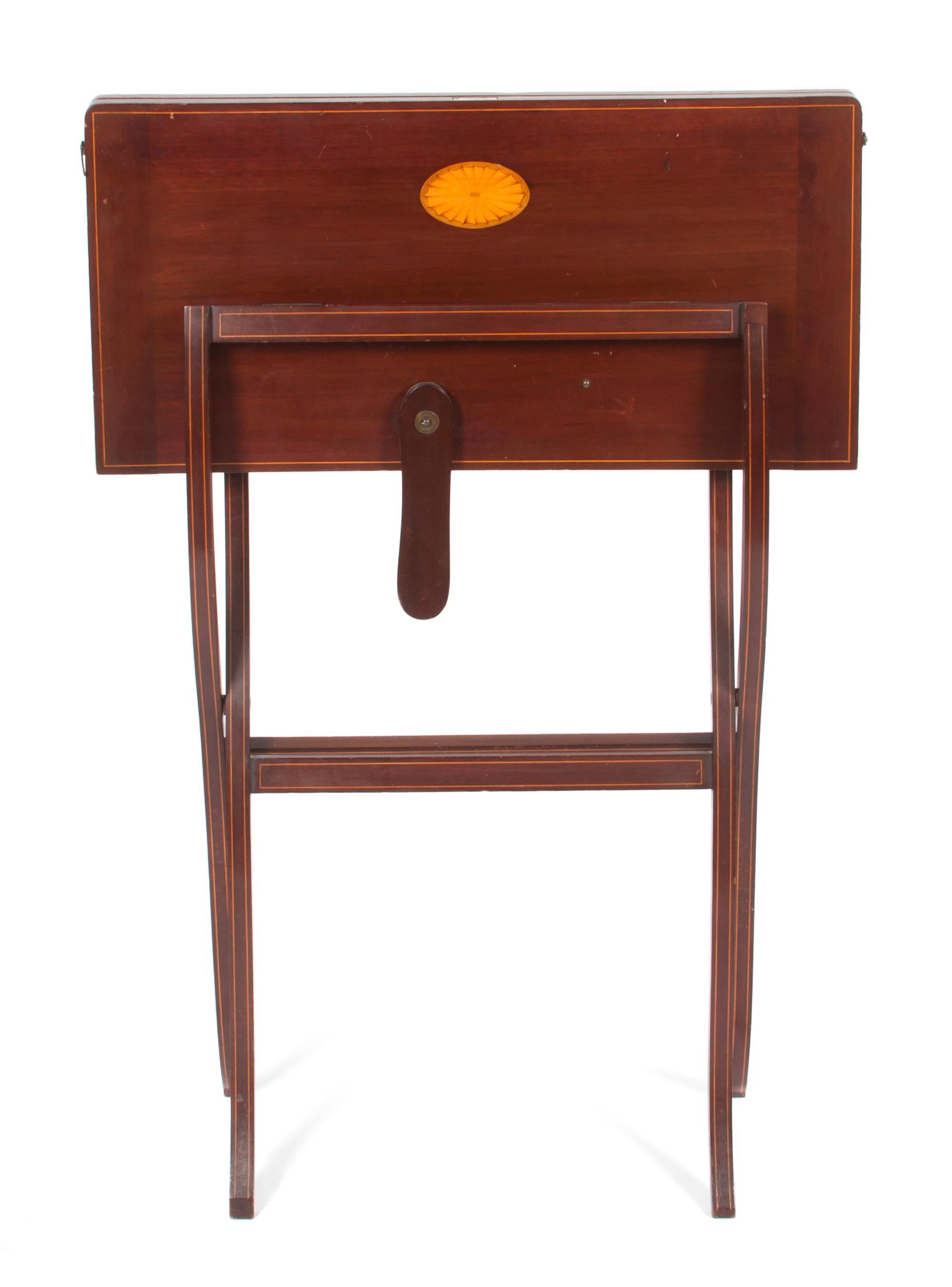 A Georgian Style Mahogany Coaching Table Height 38 1/2 inches (closed).