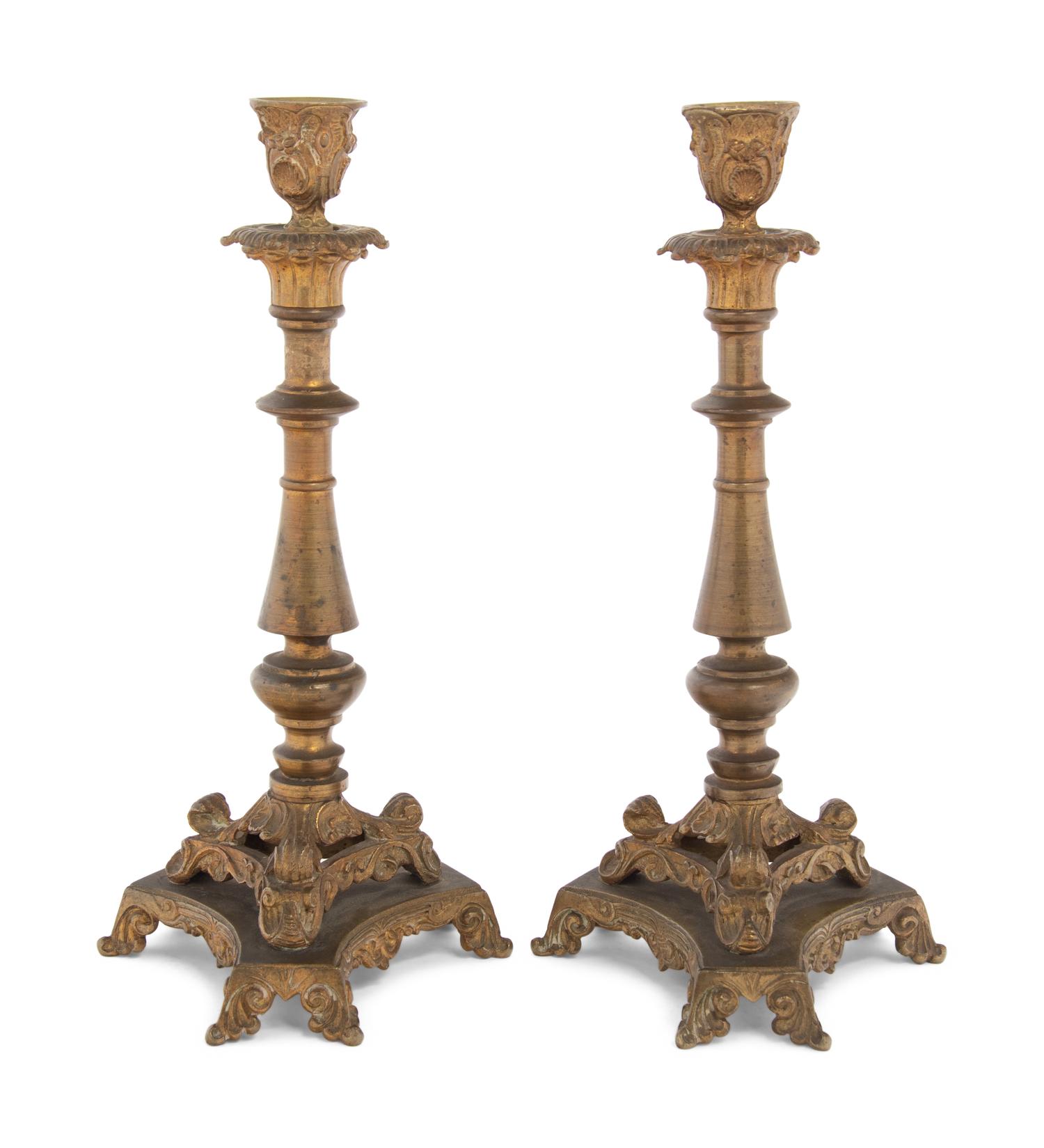 A Pair of Neoclassical Gilt Bronze and Brass Candlesticks