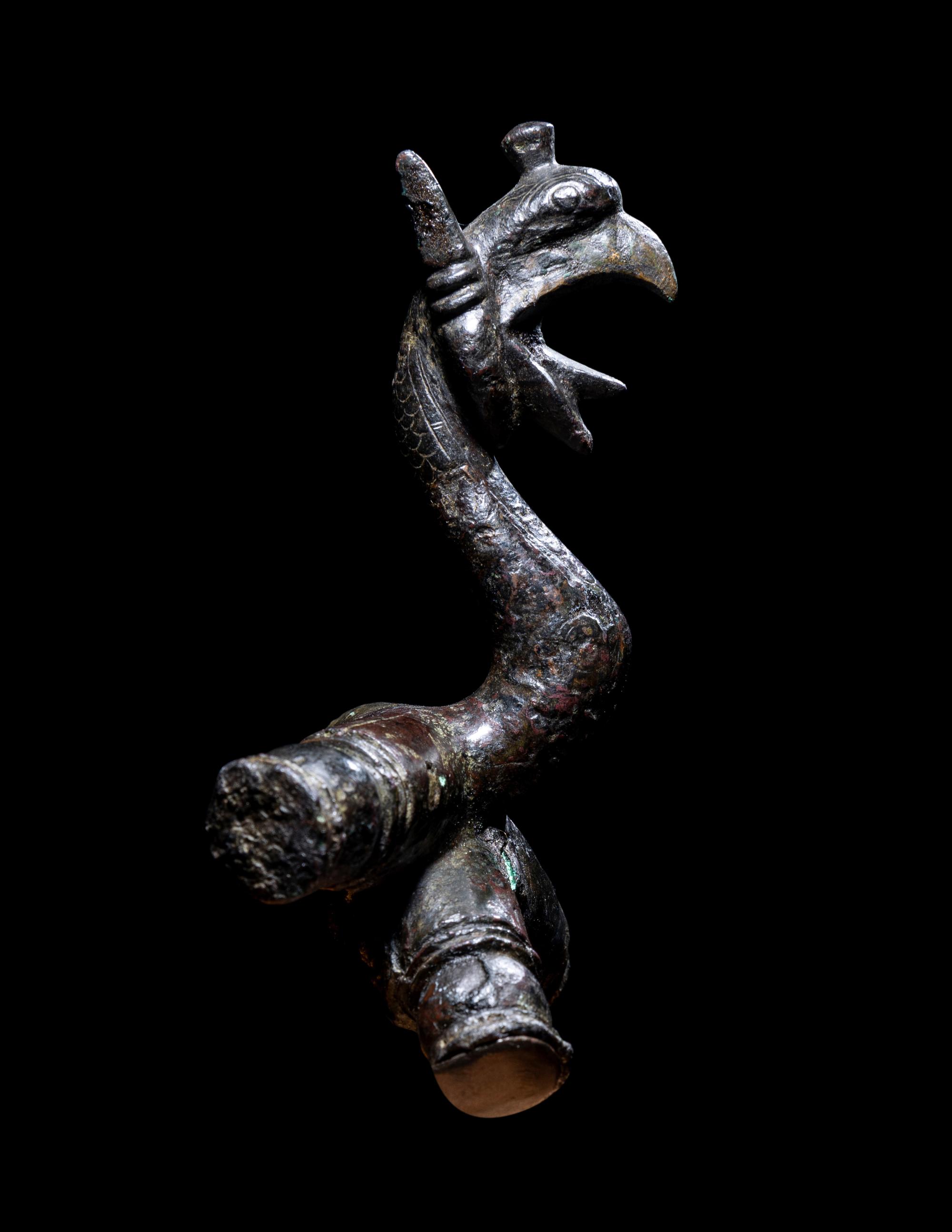 An East Greek Bronze Griffin Protome