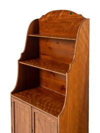 A Pair of Regency Satinwood and Part-Ebonized Waterfall Bookcases