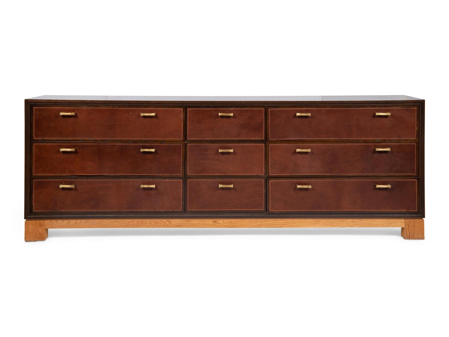 An Oak and Leather-Veneered and Brass Mounted Cabinet