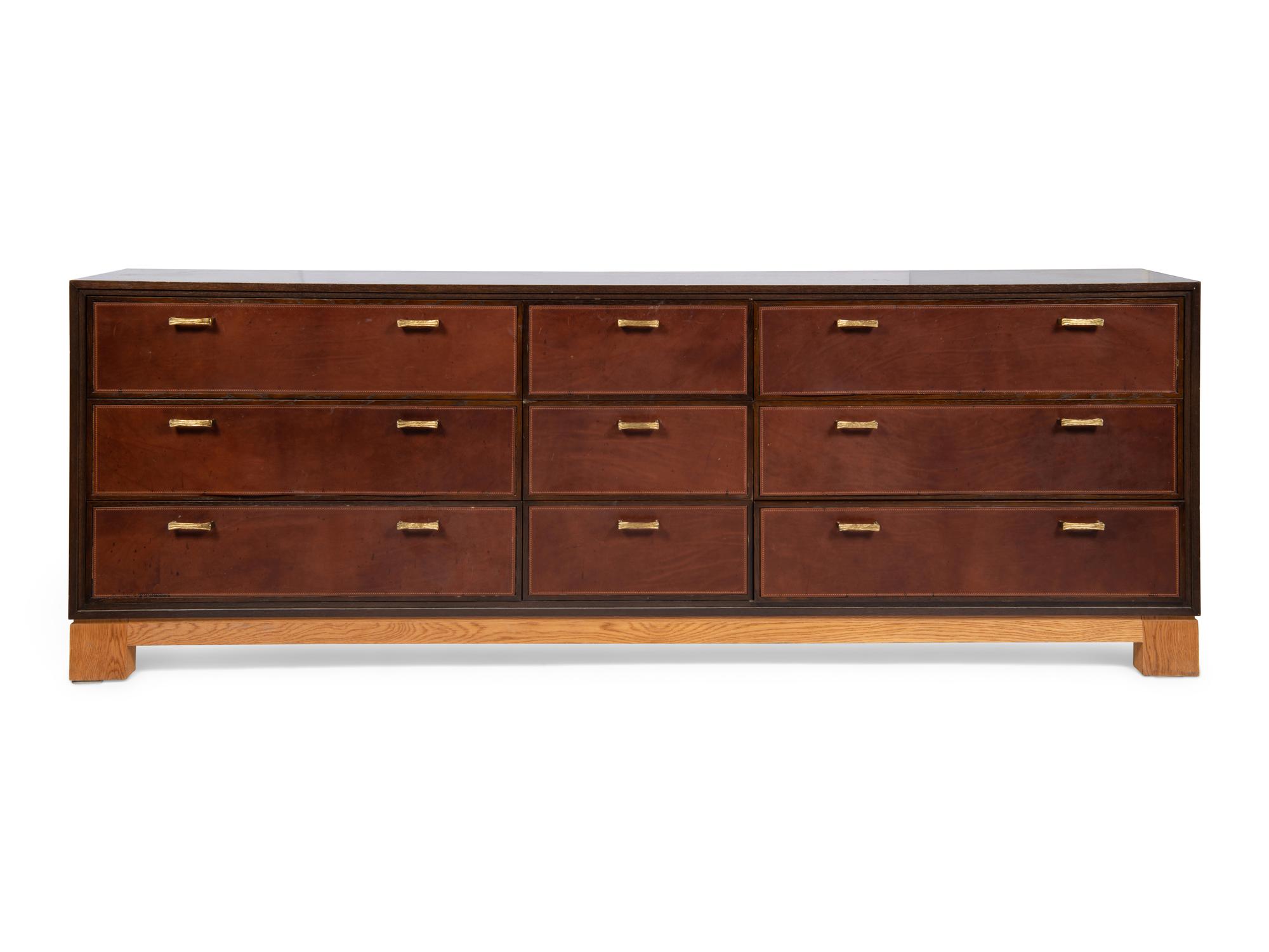 An Oak and Leather-Veneered and Brass Mounted Cabinet
