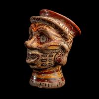 A Mixtec Polychrome Vessel in the form of a Head