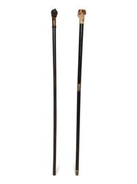 Two Ebonized Walking Sticks with Zoomorphic Handles