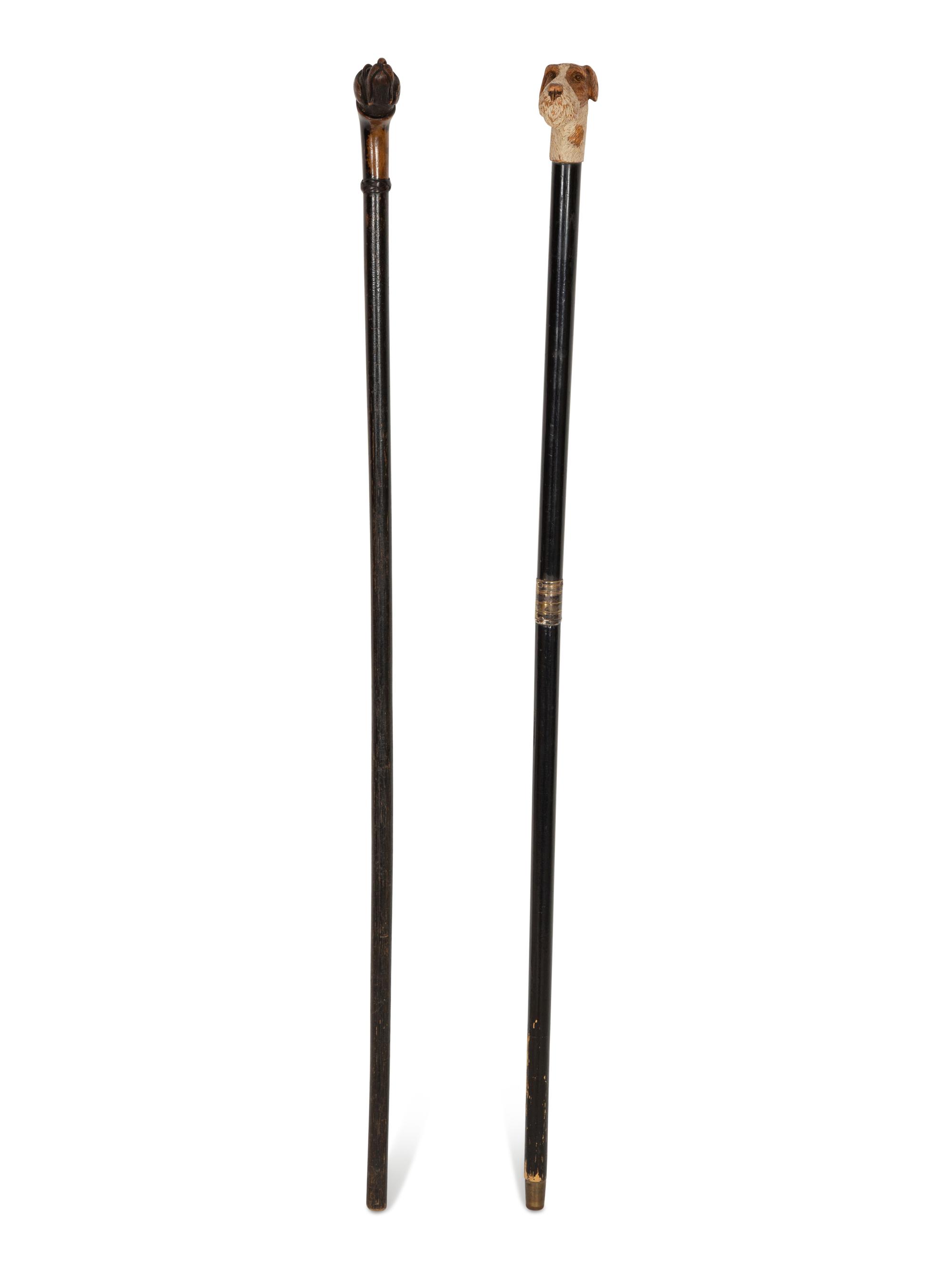 Two Ebonized Walking Sticks with Zoomorphic Handles