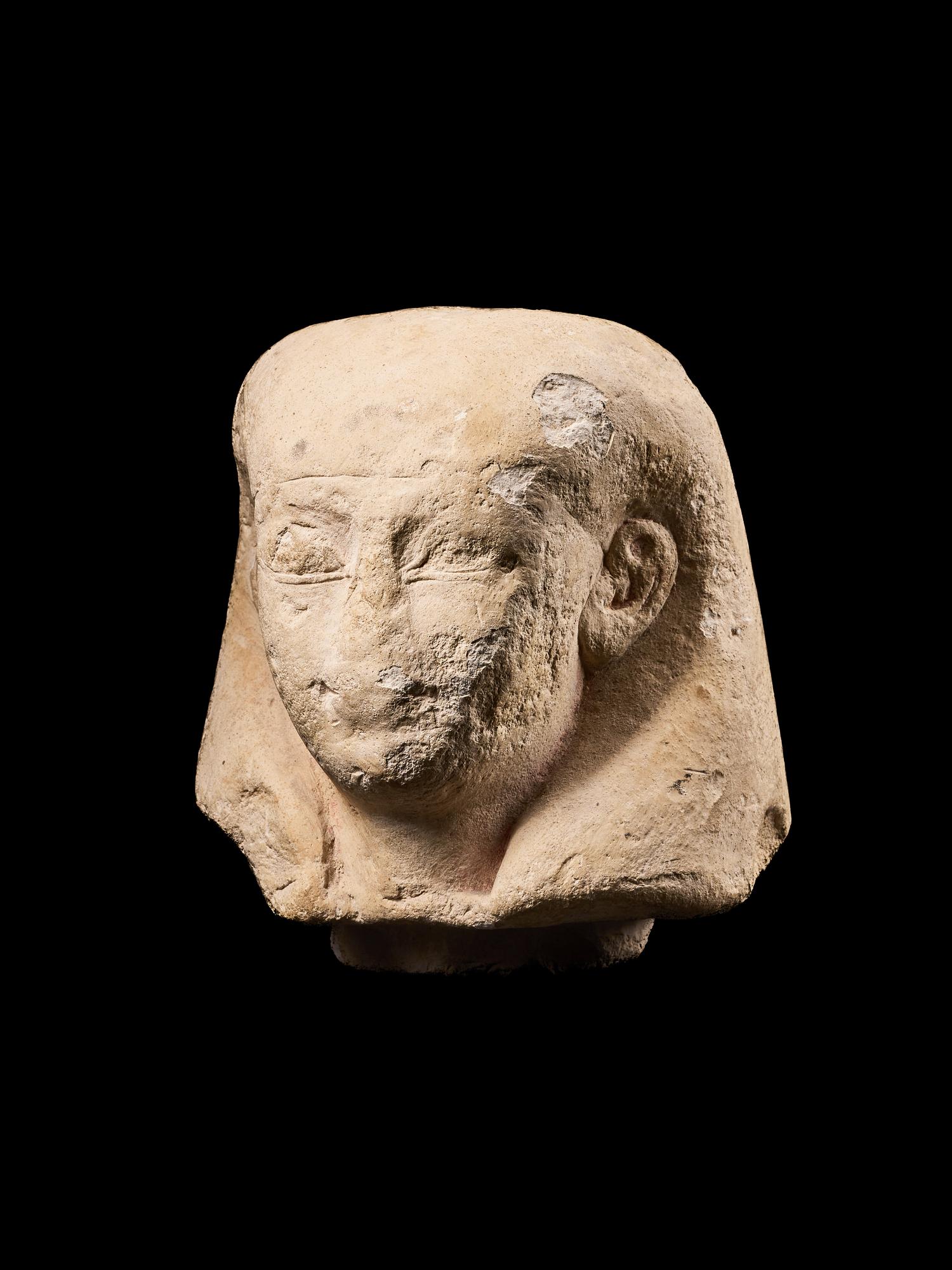 An Egyptian Limestone Canopic Jar Lid for Imseti