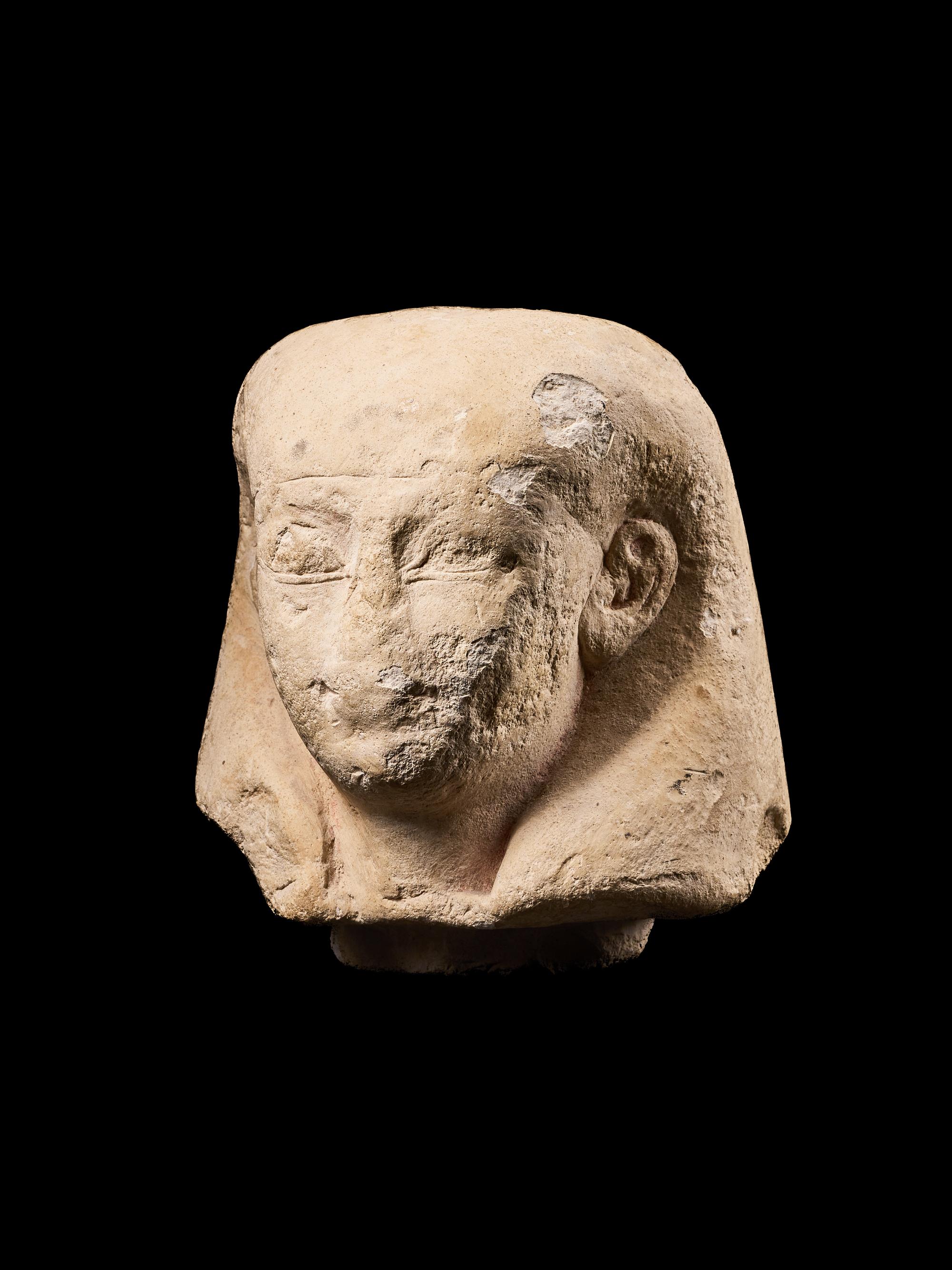 An Egyptian Limestone Canopic Jar Lid for Imseti