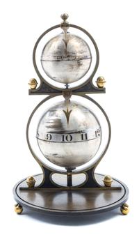 A Gustave Jeager Double Globe Patent Clock Height overall 16 inches. — LATE 19TH/EARLY 20TH CENTURY