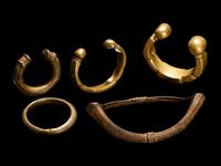 Five African Metalwork Currency Bracelets