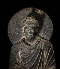 A Gandharan Grey Schist Figure of Seated Buddha