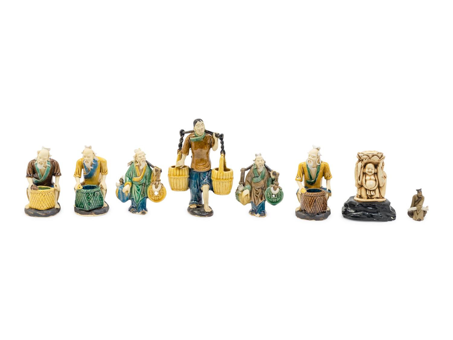 Eight Chinese Polychrome Enameled Pottery Figures