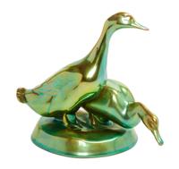 A Zsolnay Iridescent Glazed Figural Group Height 7 inches.