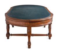 An Aesthetic Movement Leather Inset Carved Walnut Board Table