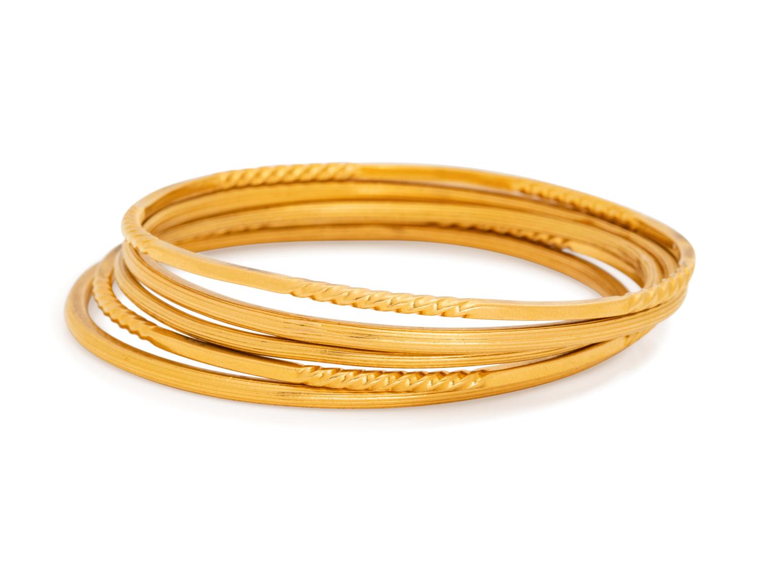 COLLECTION OF YELLOW GOLD BANGLE BRACELETS