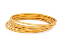 COLLECTION OF YELLOW GOLD BANGLE BRACELETS